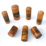 A collection of Victorian Mauchline ware cylindrical boxes.