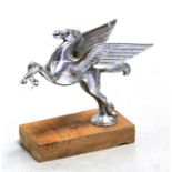 A chrome plated Mobil oil accessory car mascot in the form of Pegasus mounted on a plinth, 11cms (