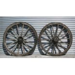 A pair of iron bound cart wheels, 117cms (46ins) diameter (2).