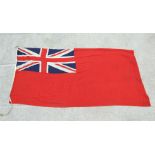 A Naval Red ensign flag. 130 by 255cm (51 by 100.5 ins)