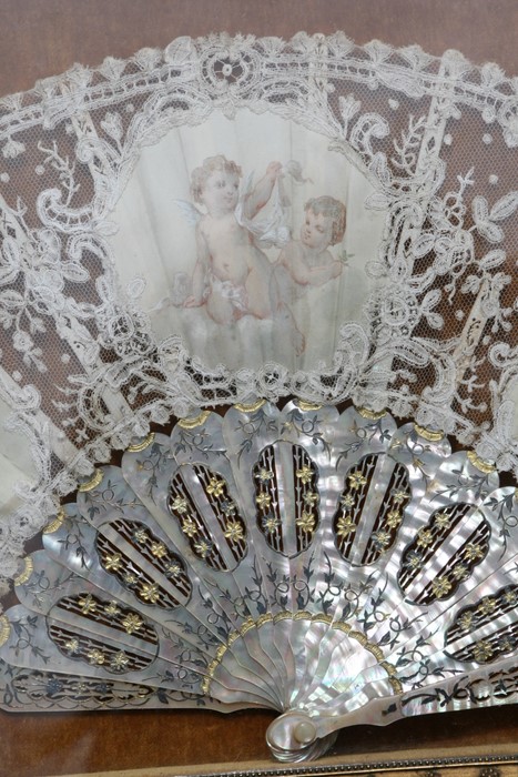 A 19th century fan with mother of pearl sticks and lace leaf decorated with three vignettes with - Image 5 of 7