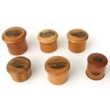 A collection of Victorian Mauchline ware cylindrical boxes.