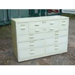 A painted pine chest with an arrangement of six drawers, 122cms (48ins) wide.