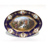 A Sevres oval porcelain cabinet plate, the central panel depicting Le Mort de Gaston de Foix en 1512