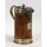 A late 19th century oak and silver plated jug with ceramic liner, with a Bacchus form spout,