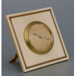 An early 20th century ivory framed strut clock, the dial with Arabic numerals within a yellow