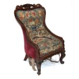 An early 19th century rosewood chair with needlework tapestry upholstery, on cabriole front
