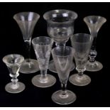 A group of 18th and 19th century wine and ale glasses to include etched example and a penny lick,