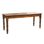 A pine farmhouse table on turned legs, 183cms (72ins) wide.Condition ReportFloor to bottom of