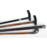 A group of four silver mounted walking sticks and canes (4).