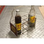 A Shell garage forecourt wire six division quart bottle carrier, with two Shell Rotella glass