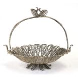 A white metal filigree basket, 15cm (6ins) high.