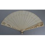 A 19th century Dieppe ivory fan, both front and back guards deeply carved and pierced with scrolling