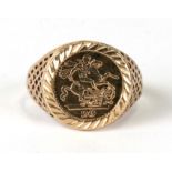 A 9ct gold simulated coin set ring, approx UK size 'Q'