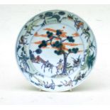 A Chinese Ducai shallow bowl decorated with deer under a tree, 19cms (7.5ins) diameter.