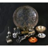 A circular silver plated galleried tray; together with a silver plated wine taster; a Tibetan bowl