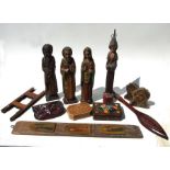 A group of Spanish carved wooden religious figures, a set of postal scales, turned wooden vases