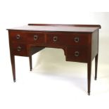 An Edwardian mahogany sideboard with an arrangement of four drawers, on square tapering legs, 123cms