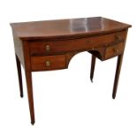 A 19th century bowfronted side table with single frieze drawer above two short drawers, on square