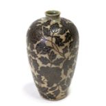 A Japanese studio Meiping vase decorated with flowers and leaves carved into a dark celadon