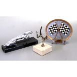 A leaping jaguar car mascot mounted on a plinth, 20cms (8ins) long, an accessory car mascot in the