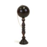 A 19th century lignum vitae Bilboquet or cup & ball game, 156cms (6.25ins) high.