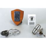 A Rolls Royce Jack Barclay Ltd paperweight, 5cms (2ins) wide, a Rolls Royce chrome badge mounted