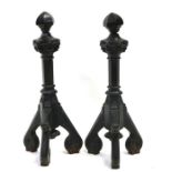 A pair of large Gothic style iron fire dogs, 59cms (23ins) high (2).