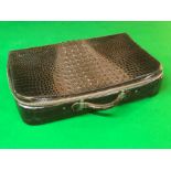 A crocodile leather overnight case, with fitted toilette interior, the items having Shagreen style