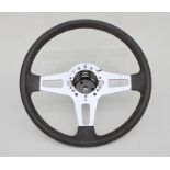 A Volkswagen Gulf MKI aluminium three-spoke steering wheel, part no. 171410091F, 38cms (15ins)