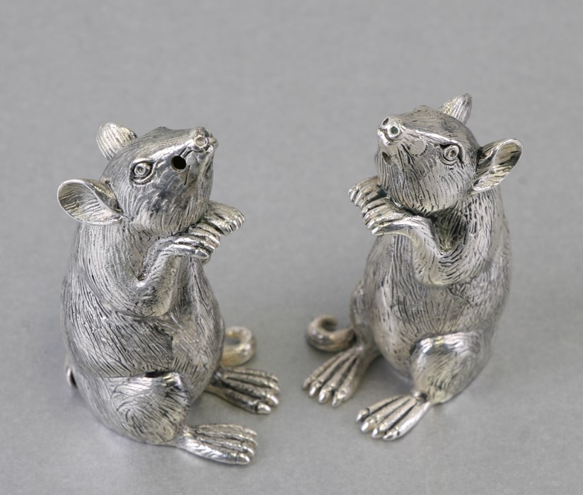 A pair of novelty silver plated salt and pepper pots in the form of mice, 5cms (2ins) high; together