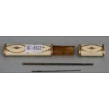 A Regency ivory needle case with yellow metal decoration, 9cms (3.5ins) high. Condition