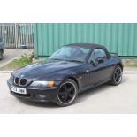 A 1999 BMW Z3 1.8 Roadster, registration number T774 JNW, black. Finished in black with a black
