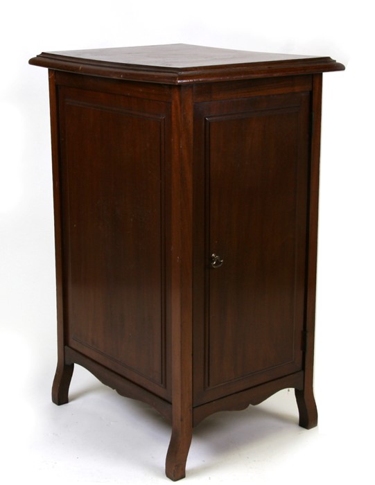 A late 19th century mahogany filing cabinet, the panelled door enclosing five filing drawers,