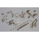A quantity of silver and costume jewellery to include rings, bracelets and a locket; together with a