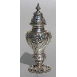 A Victorian silver sugar caster decorated with flowers, London 1893 and maker's mark for Cornelius