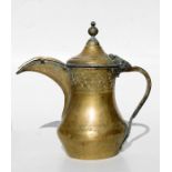 A Turkish / Islamic brass dallah coffee pot, 27cms (10.5ins) high.