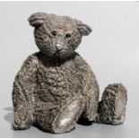 A country artist's filled silver figure of a seated teddy bear wearing spectacles, Birmingham
