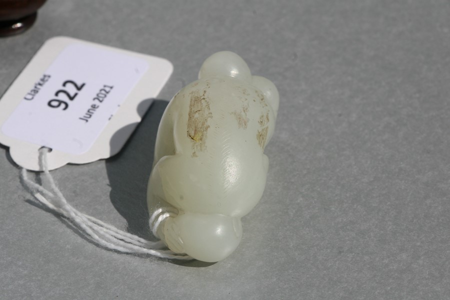 A Chinese jade figure in the form of a monkey holding a fruit, on an associated hardwood stand, 5cms - Image 8 of 9