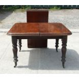 A 19th century mahogany extending dining table with one extra leaf, 118 by 104cms (46.5 by 41ins).