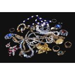 A quantity of costume jewellery to include rings, necklaces and pendants.