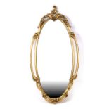 An oval gilt framed wall mirror, 95cms (37.5ins) high.