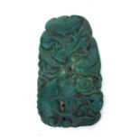 A Chinese green soapstone plaque decorated with a dragon and a fish, 15cms (6ins) high.