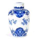 A Chinese blue & white tea caddy and cover decorated with prunus, approx 22cms (8.5ins) high.