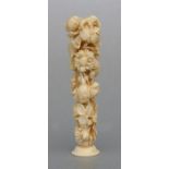 A 19th century Dieppe ivory desk seal, deeply and profusely carved with scrolling flowers, 10cms (