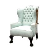 A 18th century style wing armchair, partially re-upholstered.