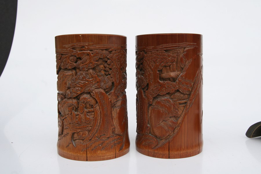 A pair of Chinese bamboo brush pots decorated with figures in a landscape, 15cms (6ins) high); - Image 7 of 10