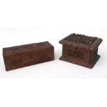 A Chinese sandalwood box deeply carved with figures in a landscape, 19cms (7.5ins) wide; together