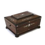 A Victorian rosewood sewing box with mother of pearl inlaid decoration, on bun feet, 30cms (12ins)
