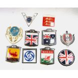 Assorted badge bar badges including British Leyland, National Traction Engine Club and others.